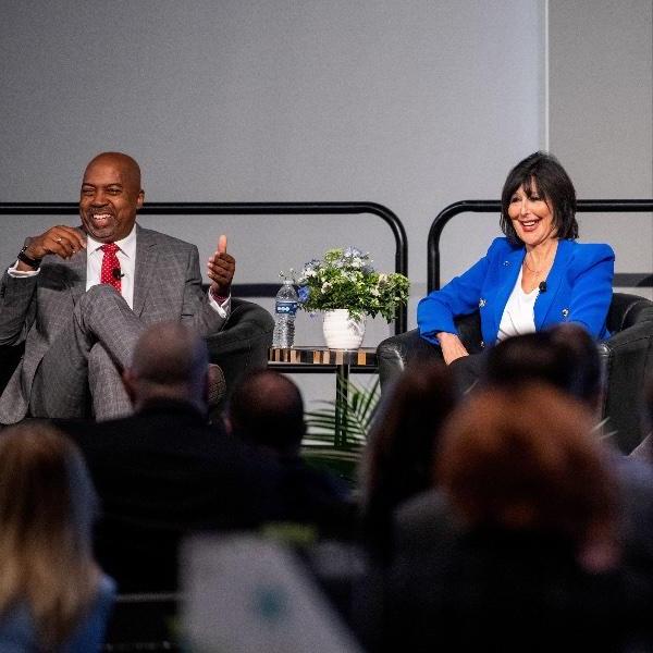 大峡谷总统菲洛梅娜·V. Mantella and Ferris State President Bill Pink share a laugh on stage during a panel discussion.